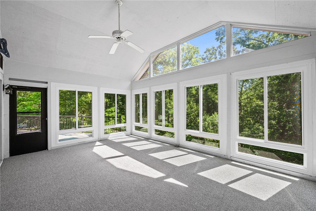 118 Beacon Ridge Circle Salem, SC 29676 - Photo 12 of 45 A spacious sunroom offers soaring ceilings, a ceiling fan, and extensive windows framing verdant outdoor views.