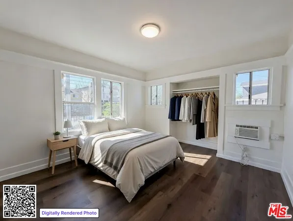 a bed room with a bed and a window