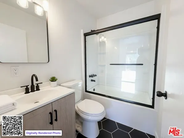 a bathroom with a sink toilet and mirror