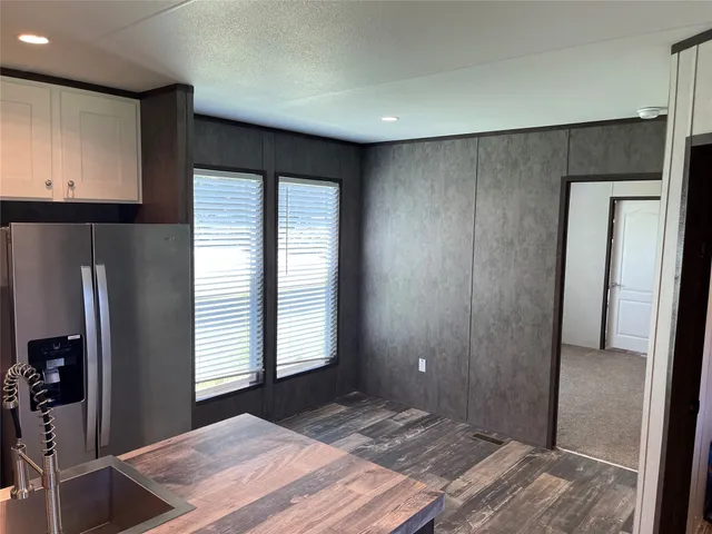 a bedroom with a bed and a dresser in it