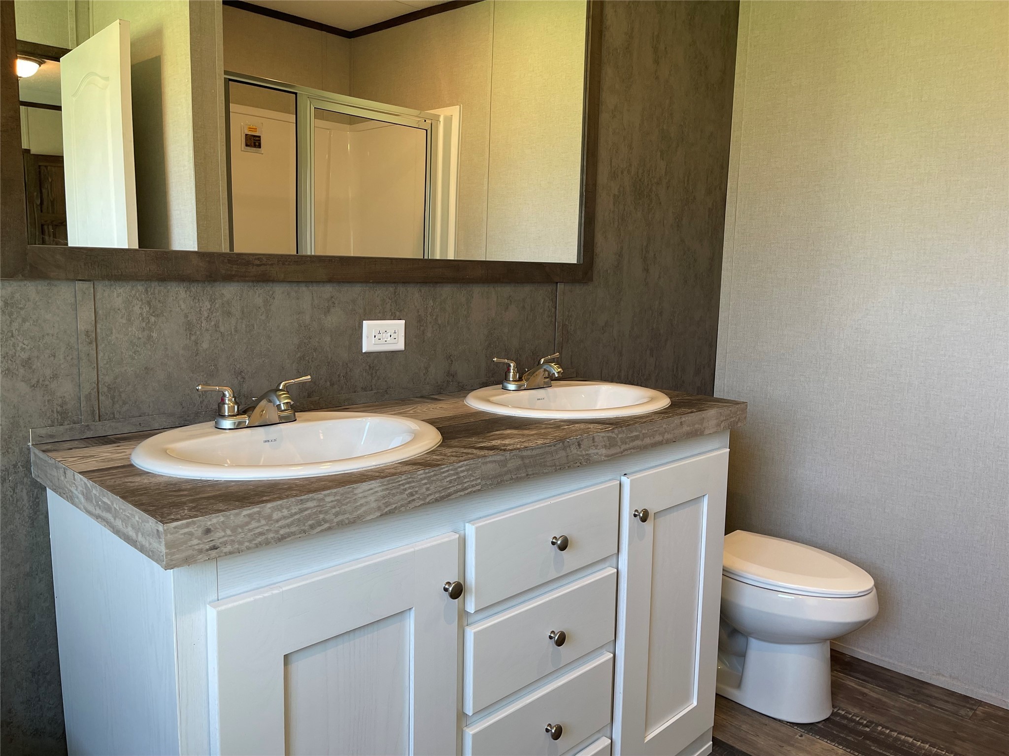 322 College Street Fairfield, TX 75840 - Photo 22 of 34 a bathroom with a granite countertop sink and a toilet