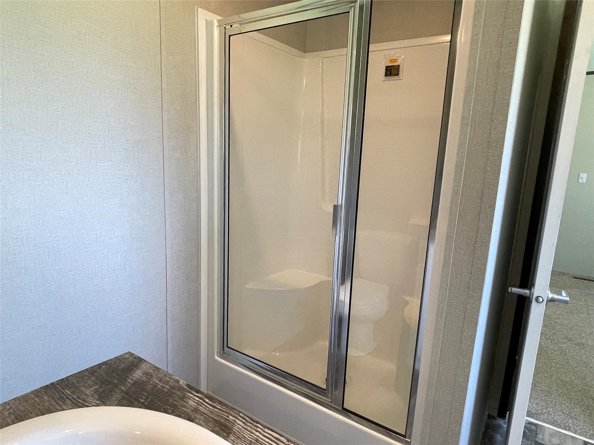 322 College Street Fairfield, TX 75840 - Photo 23 of 34 a bathroom with a glass door