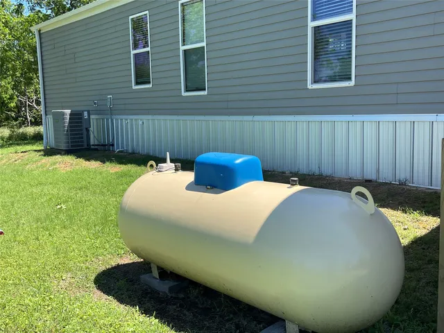 a view of a backyard with a tub