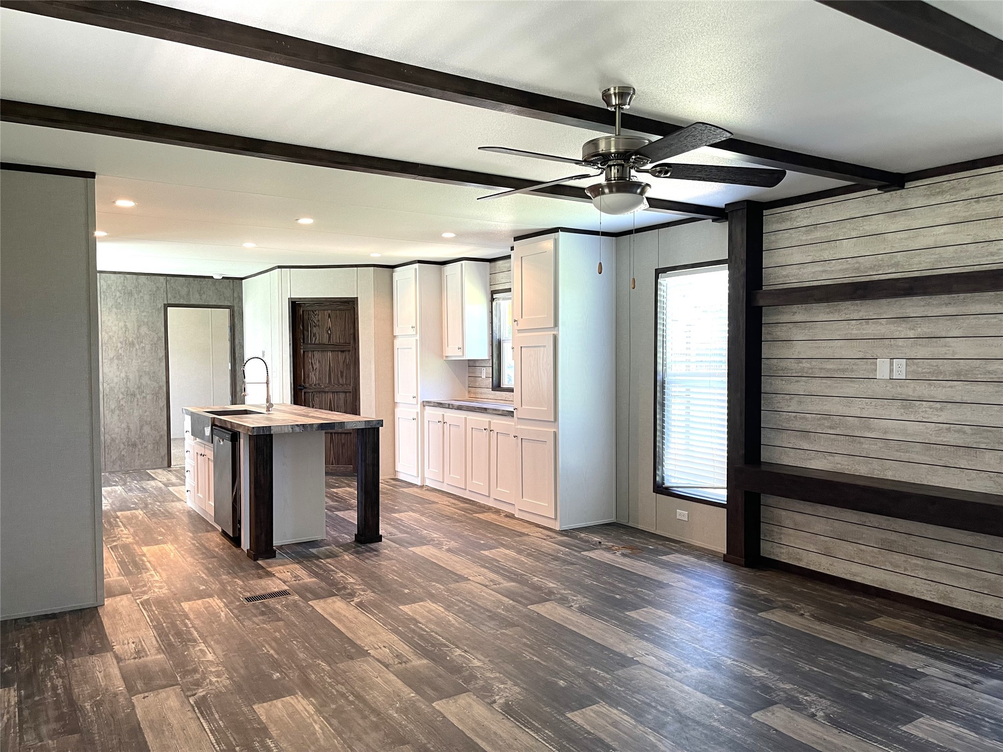 322 College Street Fairfield, TX 75840 - Photo 6 of 34 a view of a hallway with wooden floor and a living room