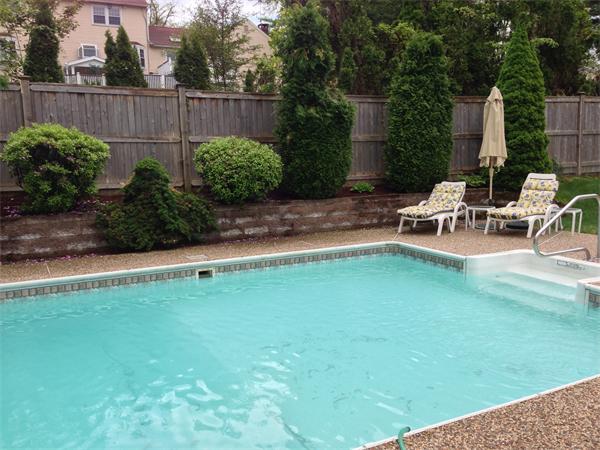 71 Donna Road Newton, MA 02459 - Photo 16 of 17 a view of a backyard with sitting area and garden