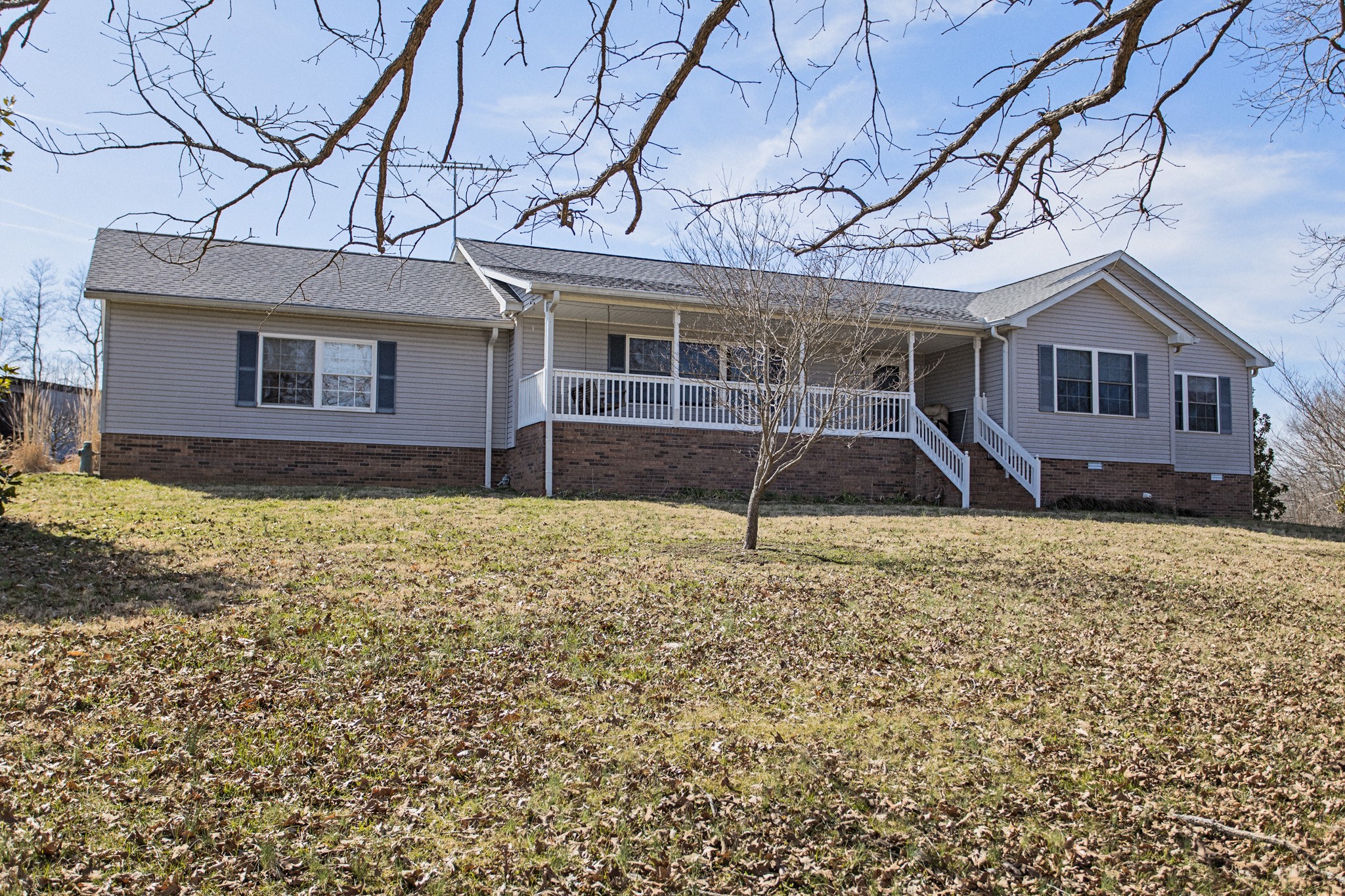 3579 Kinneys Road Cedar Hill, TN 37032 - Photo 1 of 26 a front view of a house with a yard