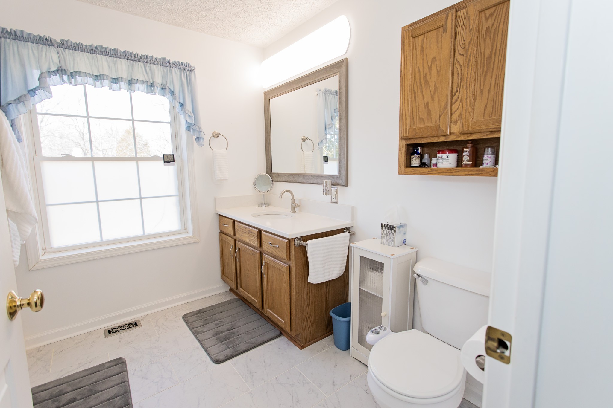3579 Kinneys Road Cedar Hill, TN 37032 - Photo 14 of 26 a bathroom with a sink toilet and window