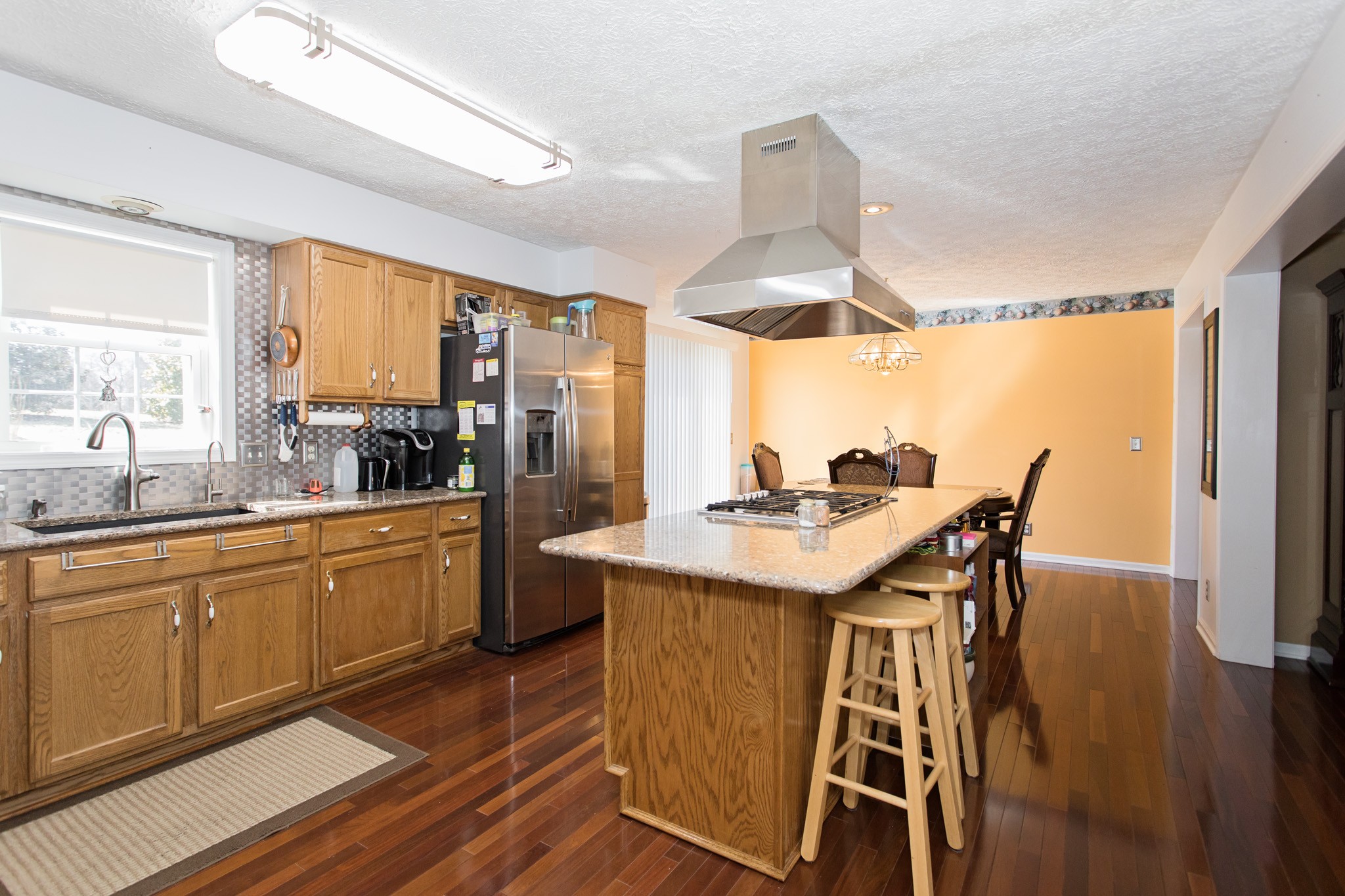 3579 Kinneys Road Cedar Hill, TN 37032 - Photo 5 of 26 a kitchen with a table chairs sink and cabinets