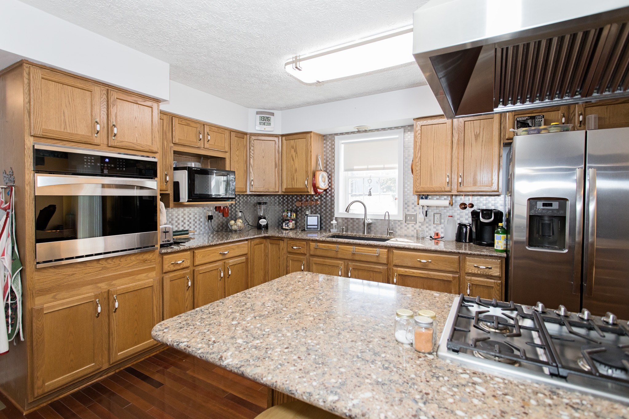 3579 Kinneys Road Cedar Hill, TN 37032 - Photo 6 of 26 a kitchen with stainless steel appliances granite countertop a refrigerator sink and cabinets