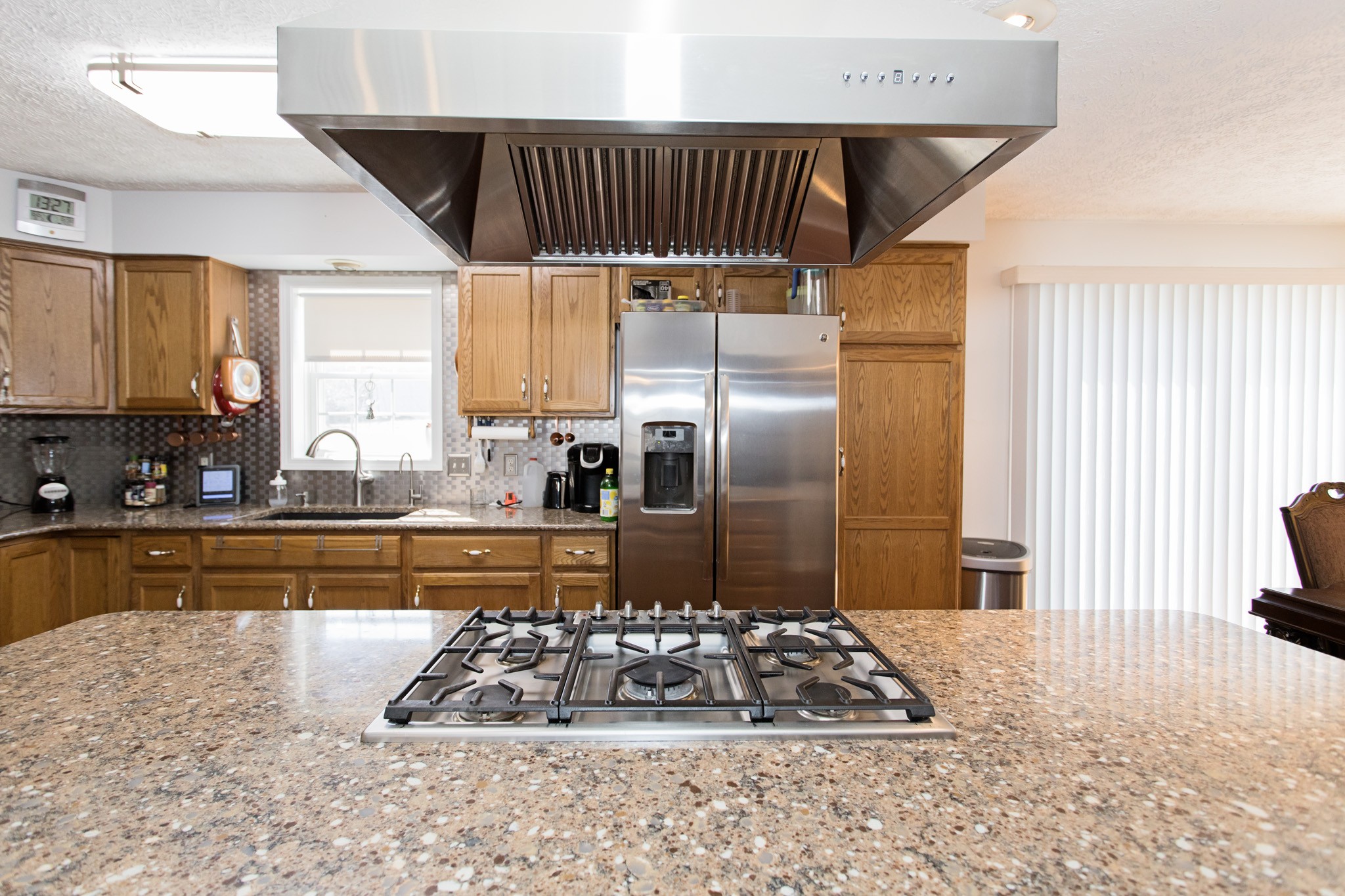 3579 Kinneys Road Cedar Hill, TN 37032 - Photo 7 of 26 a kitchen with a sink a counter top space and stainless steel appliances