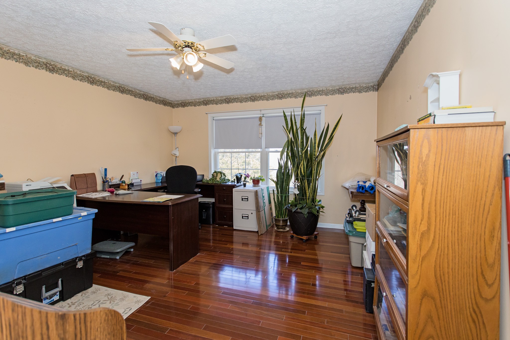 3579 Kinneys Road Cedar Hill, TN 37032 - Photo 9 of 26 a view of a workspace with furniture and a potted plant
