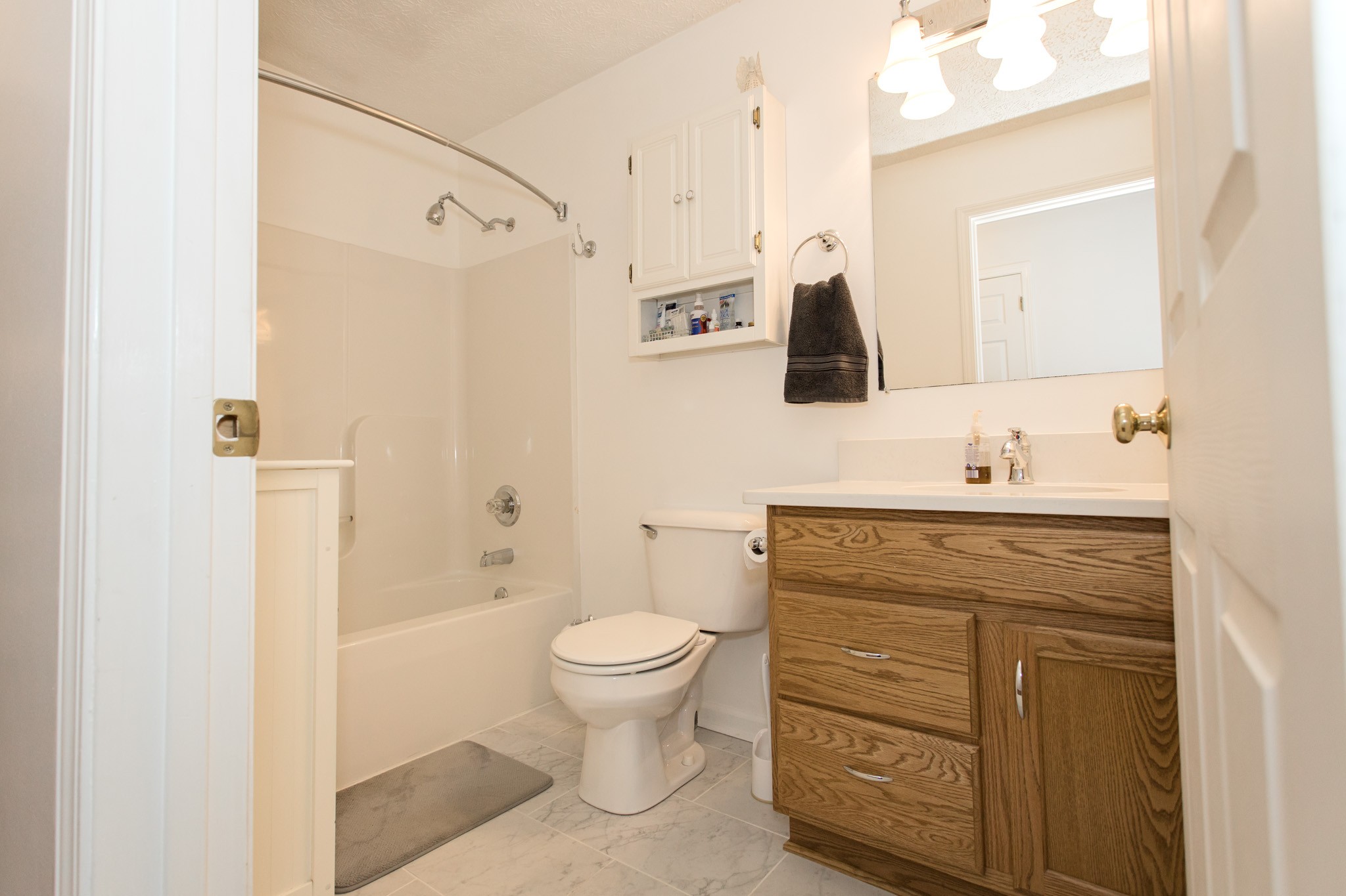 3579 Kinneys Road Cedar Hill, TN 37032 - Photo 10 of 26 a bathroom with a granite countertop sink toilet and shower