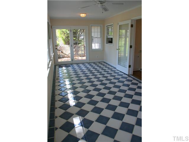 3221 Manor Ridge Drive Raleigh, NC 27603 - Photo 11 of 20 a picture of a bathroom with a black and white checkered floor