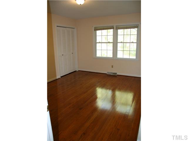 3221 Manor Ridge Drive Raleigh, NC 27603 - Photo 15 of 20 a view of a room with wooden floor and windows