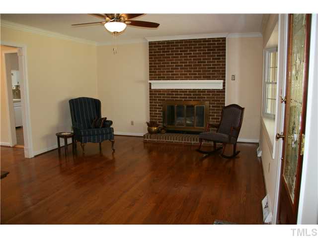 3221 Manor Ridge Drive Raleigh, NC 27603 - Photo 6 of 20 a living room with furniture and a fireplace