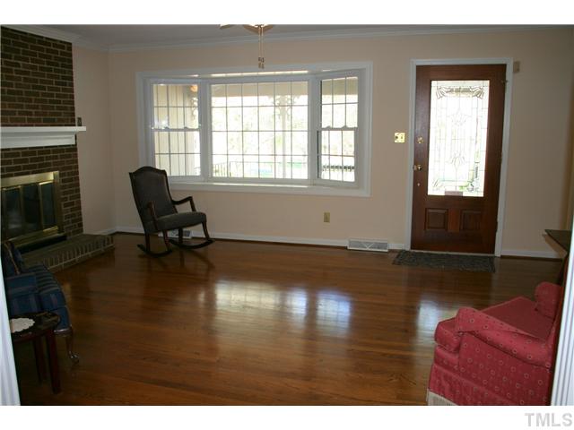 3221 Manor Ridge Drive Raleigh, NC 27603 - Photo 7 of 20 a living room with furniture window and a fireplace
