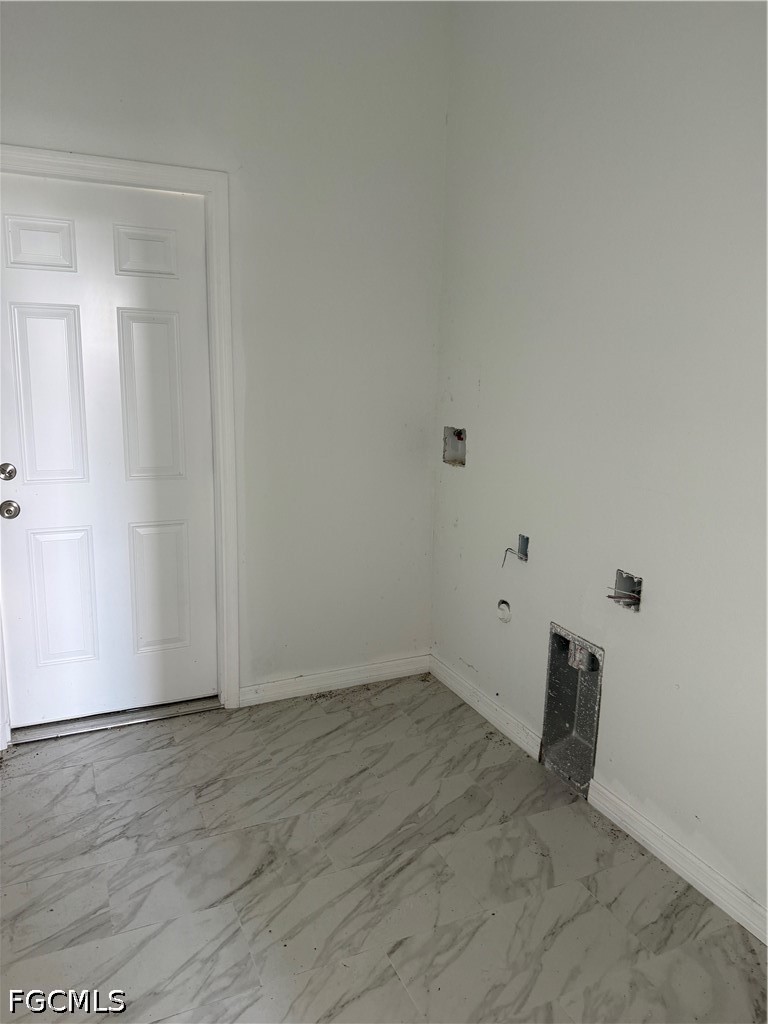 10658 Rainsville Street Port Charlotte, FL 33981 - Photo 12 of 21 an empty room with wooden floor and windows