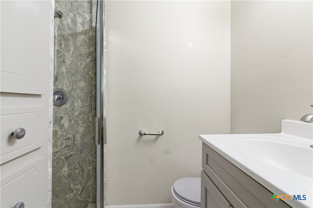 3905 Mariam Road Temple, TX 76502 - Photo 17 of 17 a bathroom with a sink a toilet and shower