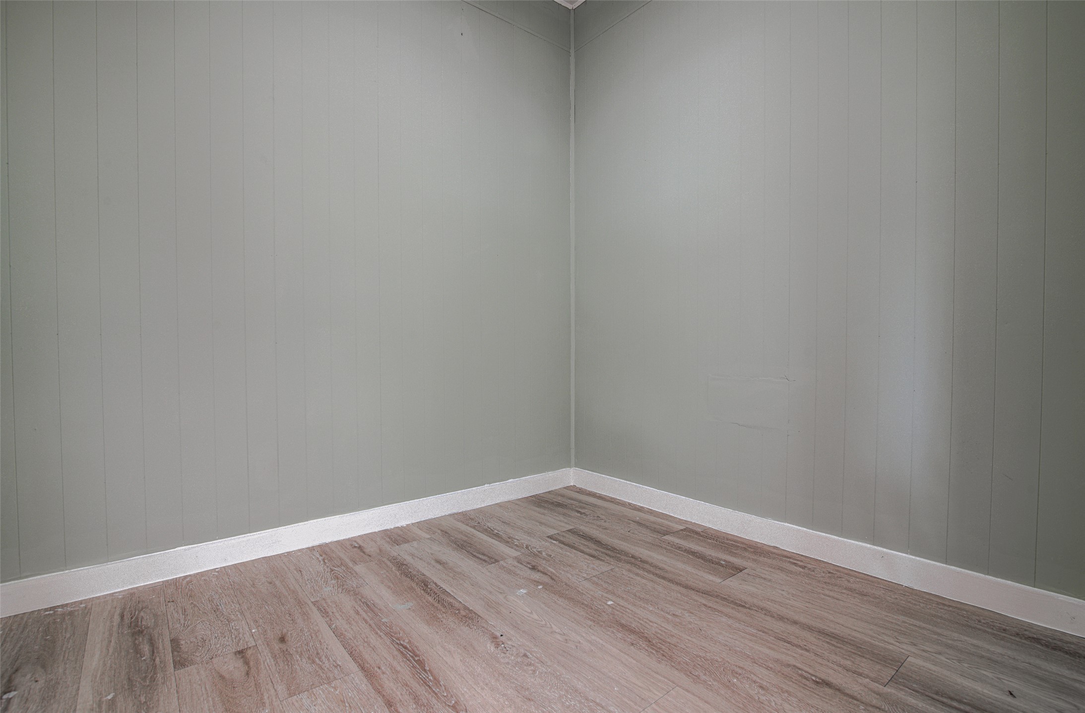 207 Haley Road Johnson City, TX 78636 - Photo 22 of 31 The subtle vertical paneling adds character to this adaptable room, ready for your personalized touch.