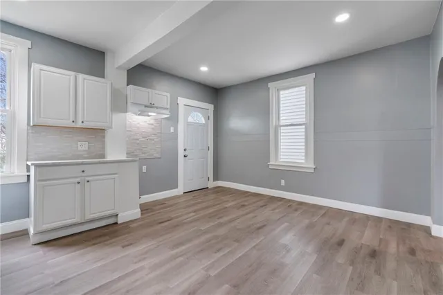 a white toilet sitting next to a bathroom sink