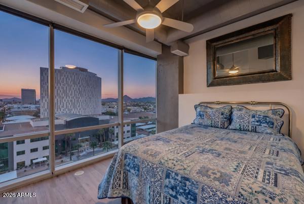 1 East Lexington Avenue, Unit 809 Phoenix, AZ 85012 - Photo 22 of 44 a bedroom with a large bed and a chandelier