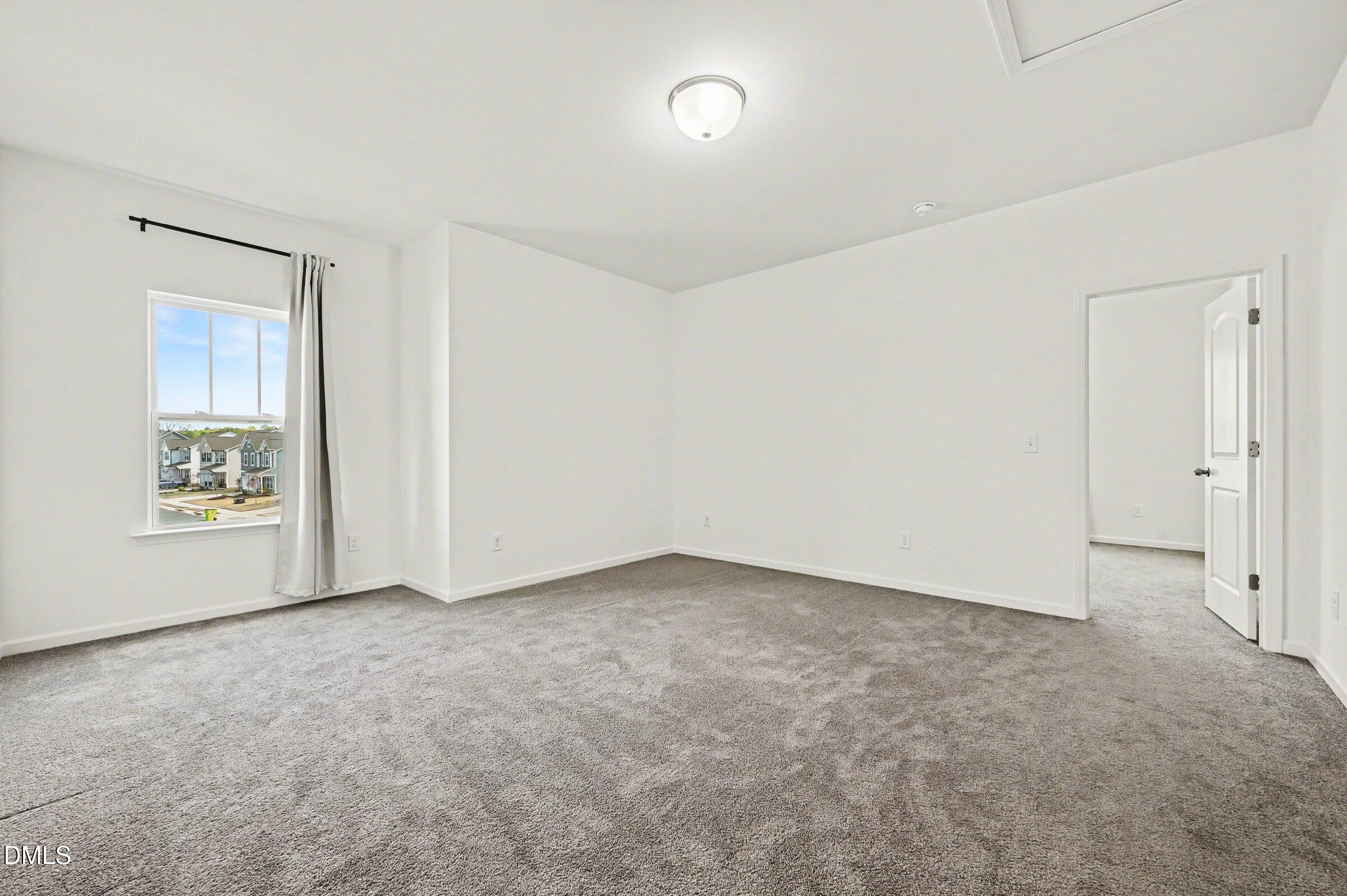 7015 Grainfield Road Mebane, NC 27302 - Photo 20 of 42 an empty room with windows