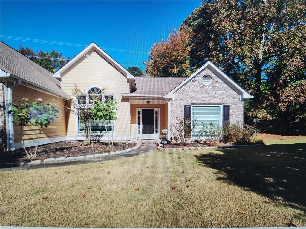 a front view of a house with garden