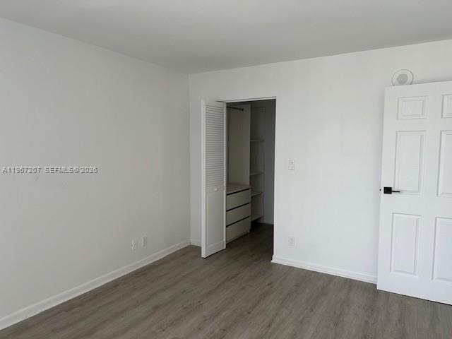 17021 North Bay Road, Unit 904 Sunny Isles Beach, FL 33160 - Photo 13 of 18 a view of an empty room with closet and a window