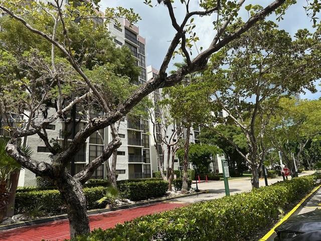 17021 North Bay Road, Unit 904 Sunny Isles Beach, FL 33160 - Photo 3 of 18 a view of a building with a yard