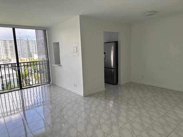 17021 North Bay Road, Unit 904 Sunny Isles Beach, FL 33160 - Photo 6 of 18 an empty room with windows