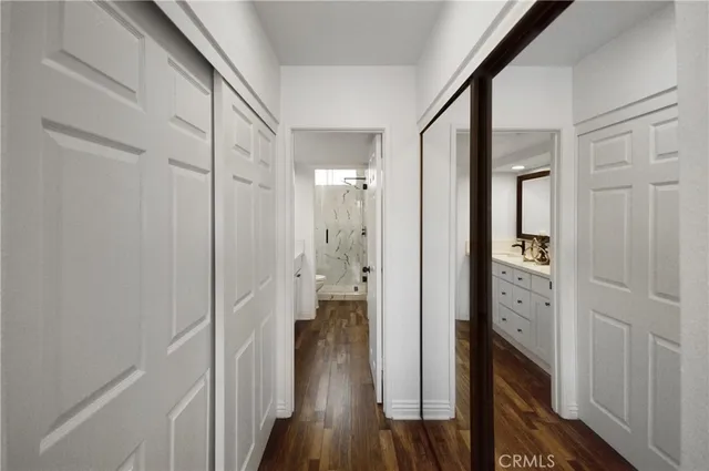 a bathroom with 2 sink and a mirror