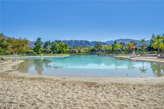 a wooden bench sitting next to a lake