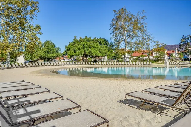 a view of a swimming pool with a yard