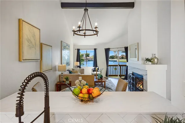 a view of a dining room with furniture wooden floor and a chandelier