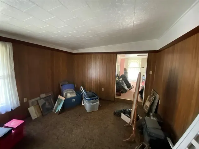a view of a roof deck with chair and garden