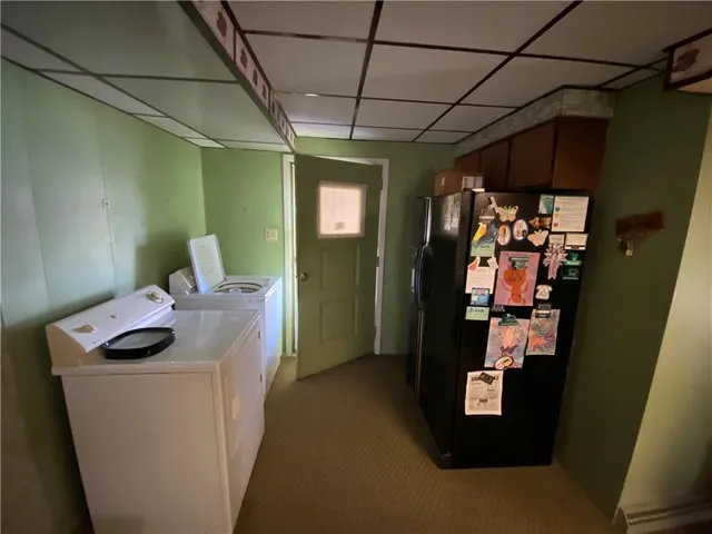 a view of a room with furniture and a window