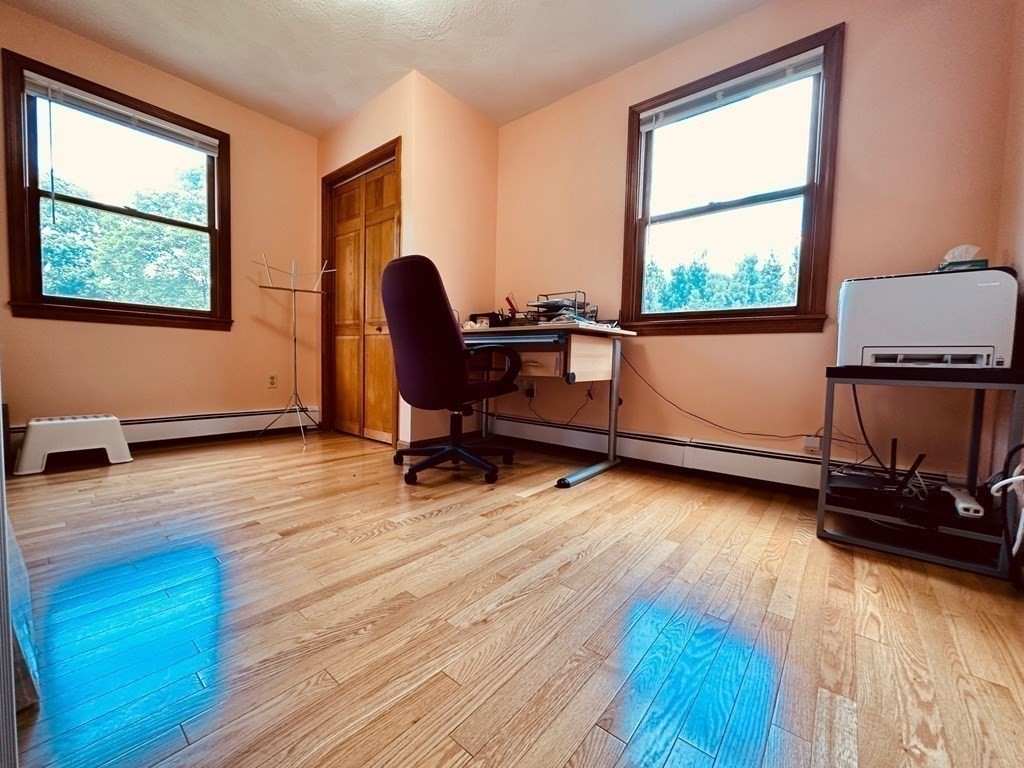 143 Reed Street Lexington, MA 02421 - Photo 16 of 19 a view of a workspace with furniture and a window