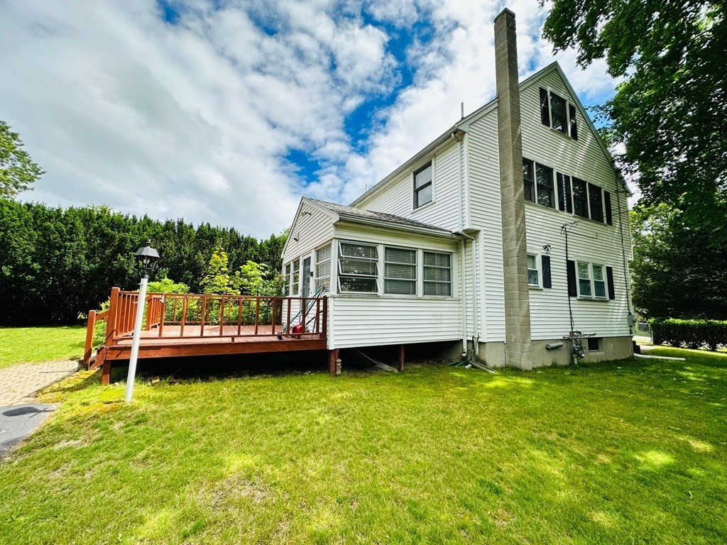143 Reed Street Lexington, MA 02421 - Photo 4 of 19 a view of a house with a backyard and sitting area