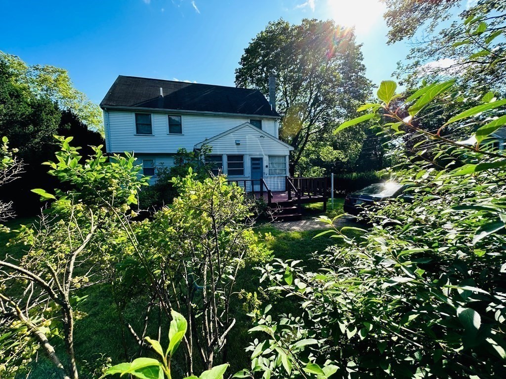 143 Reed Street Lexington, MA 02421 - Photo 6 of 19 a front view of a house with a yard
