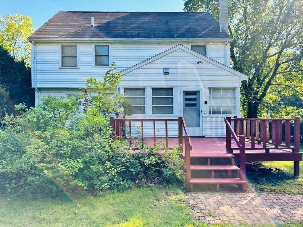143 Reed Street Lexington, MA 02421 - Photo 7 of 19 a front view of a house with a yard garden and outdoor seating
