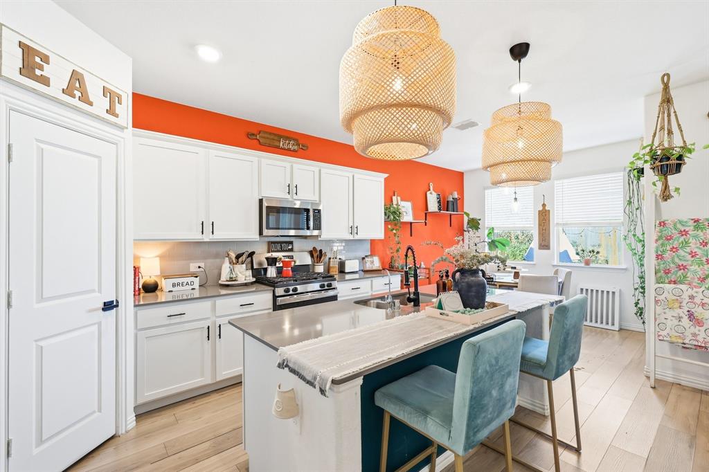 a kitchen with a sink cabinets and window