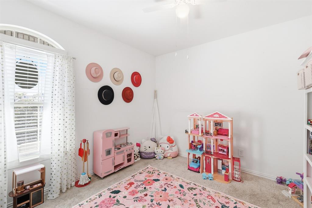 528 Ranchito Pass Fort Worth, TX 76052 - Photo 18 of 28 a bedroom with baby toys and a chandelier