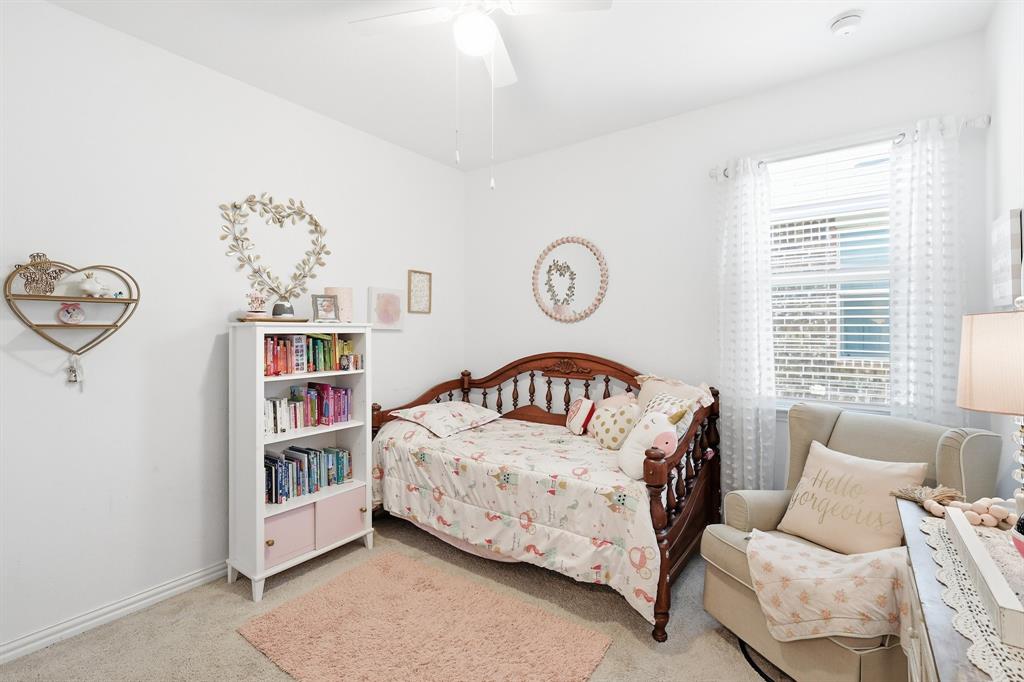 528 Ranchito Pass Fort Worth, TX 76052 - Photo 19 of 28 a bedroom with a bed furniture and window