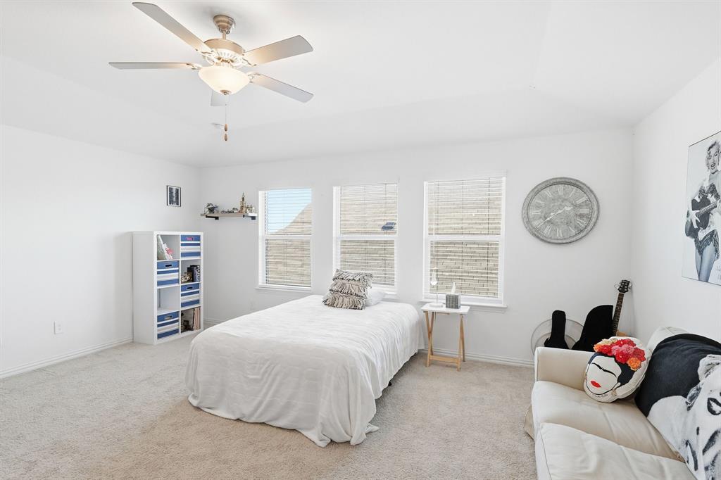 528 Ranchito Pass Fort Worth, TX 76052 - Photo 21 of 28 a bedroom with a bed furniture and a large window