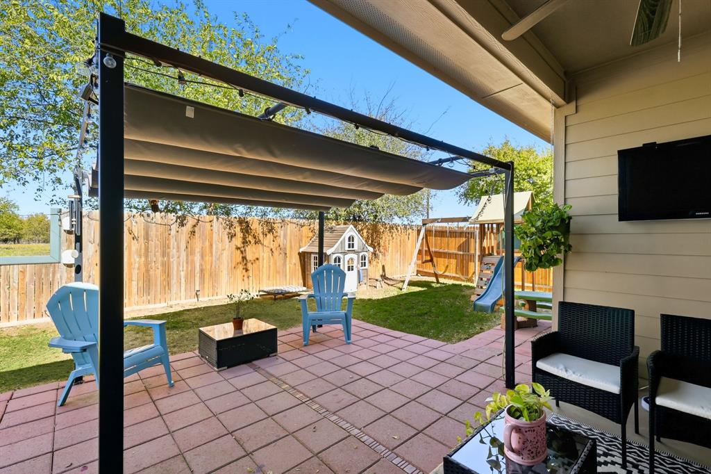 528 Ranchito Pass Fort Worth, TX 76052 - Photo 24 of 28 a outdoor living space with furniture and a fireplace