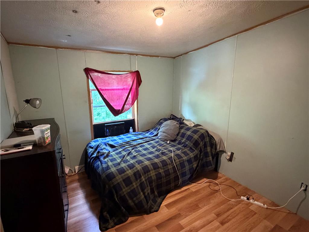4541 Main Street Slatington, PA 18080 - Photo 13 of 27 A cozy bedroom features wood-look flooring and a window offering natural illumination.