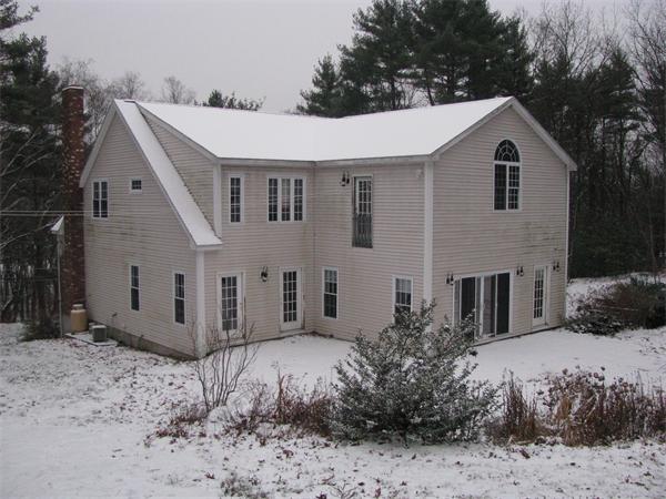 546 Fowler Road Northbridge, MA 01534 - Photo 11 of 11 a view of a white house next to a yard with large trees