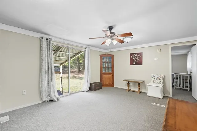 a view of livingroom with furniture and windows