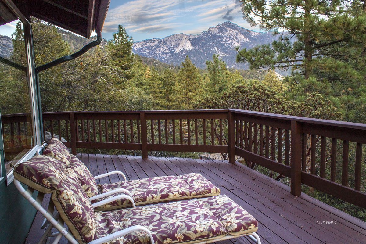 25120 Foster Lake Road Idyllwild, CA 92549 - Photo 2 of 31 a view of a balcony with furniture