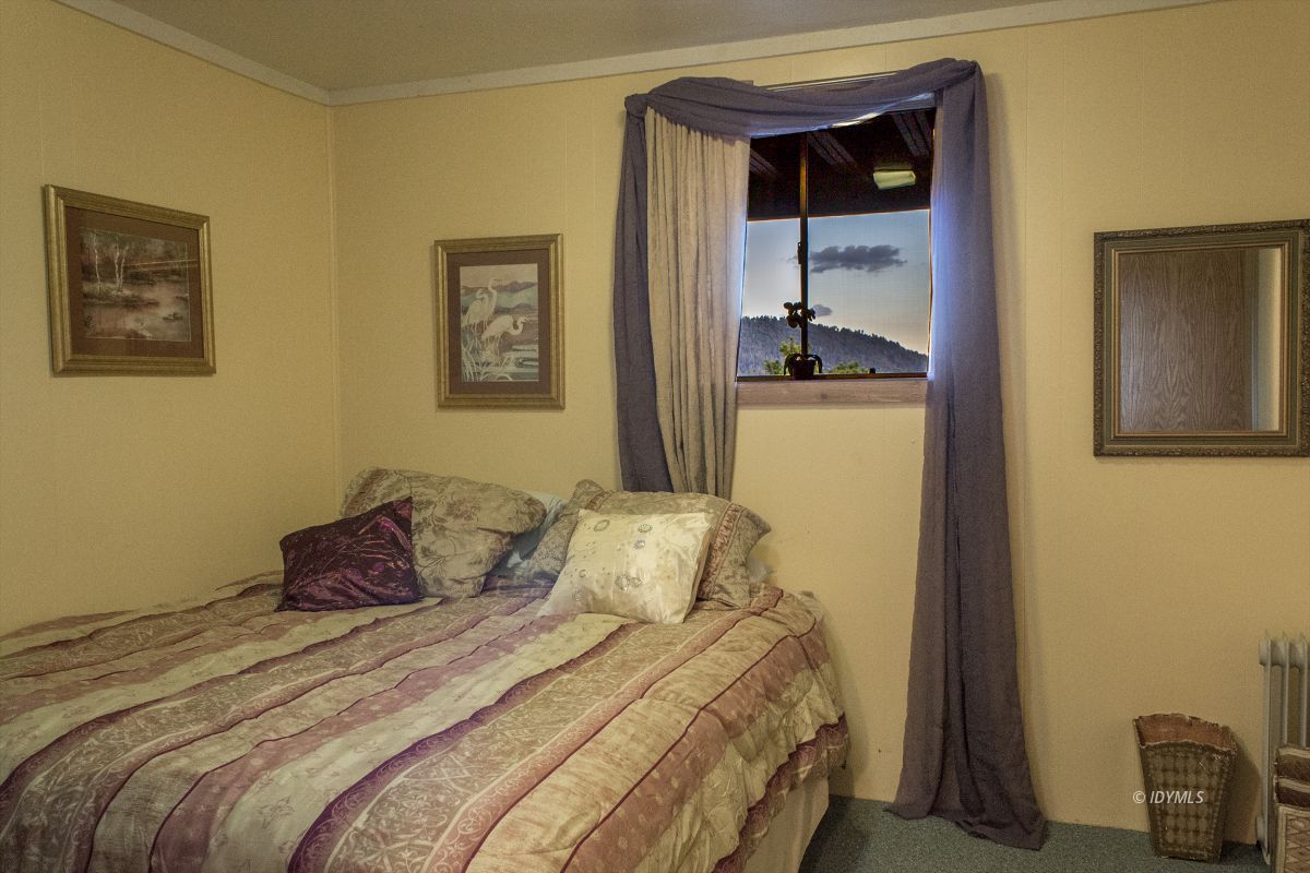 25120 Foster Lake Road Idyllwild, CA 92549 - Photo 21 of 31 a bedroom with a bed and a window